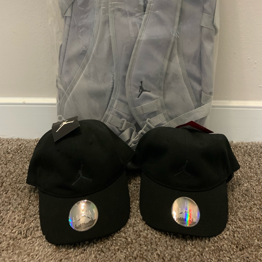 Air Jordan Jumpman Backpack with two Air Jordan Adjustable Baseball Hats.